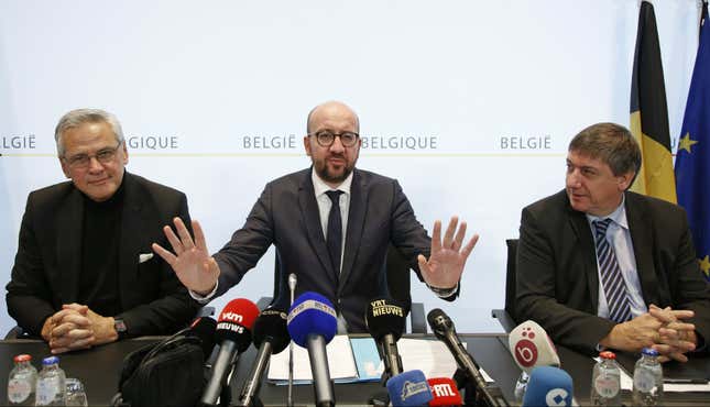 Belgium's Employment and Economy Minister Kris Peeters (L) Prime Minister Charles Michel (C) and Interior Minister Jan Jambon hold a news conference in Brussels, November 21, 2015, after security was tightened in Belgium following the fatal attacks in Paris.