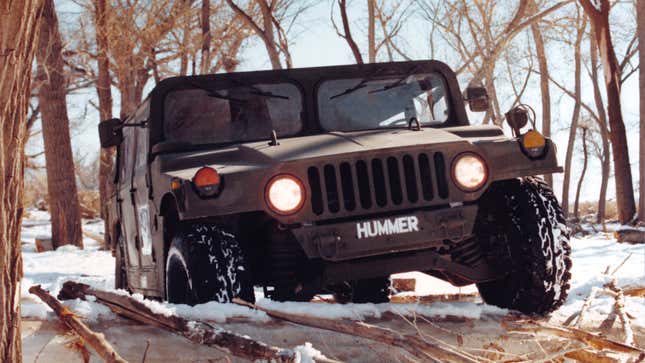 A Hummer prototype driving in snow. 