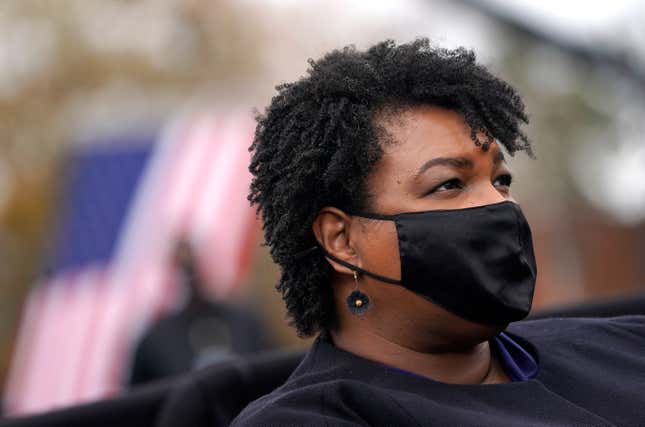 ATLANTA, GA - DECEMBER 15: Stacey Abrams looks on during a campaign rally with U.S. President-elect Joe Biden at Pullman Yard on December 15, 2020 in Atlanta, Georgia. Biden’s stop in Georgia comes less than a month before the January 5 runoff election for Senate candidates Jon Ossoff and Raphael Warnock as they try to unseat Republican incumbents Sen. David Perdue and Sen. Kelly Loeffler. 