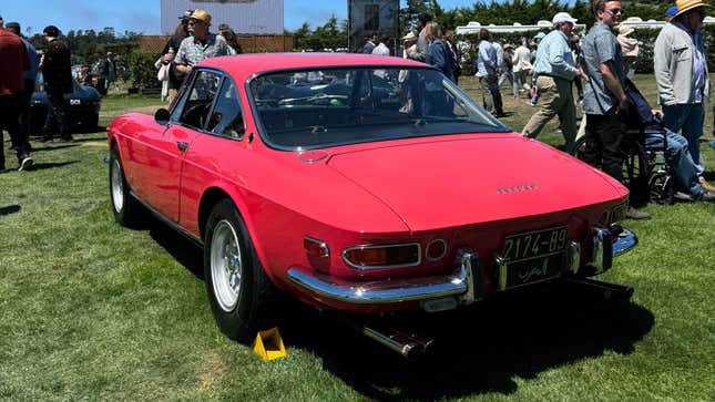 Rear 3/4 view of a Lipstick Coral Ferrari 365 GTC