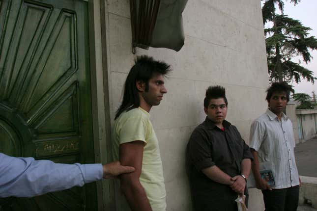 Morality police line up men with unacceptable hair styles in front of the media during a crackdown on “social corruption” in north Tehran June 18, 2008.