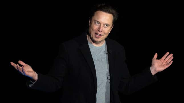 Elon Musk gestures as he speaks during a press conference at SpaceX's Starbase facility near Boca Chica Village in South Texas on February 10, 2022. - Billionaire entrepreneur Elon Musk delivered an eagerly-awaited update on SpaceX's Starship, a prototype rocket the company is developing for crewed interplanetary exploration.