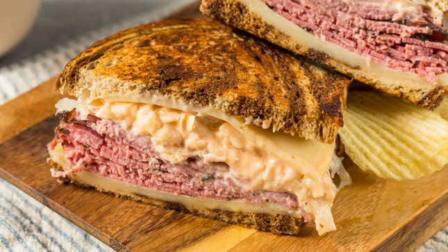 reuben sandwich on cutting board