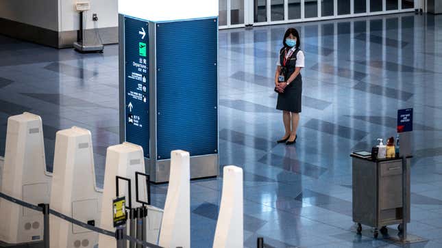 Ground staff stands in Tokyo's Haneda Airport. 