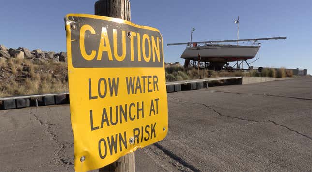 A sign warning of low water at the Great Salt Lake Marina.