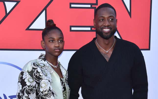 Dwayne Wade (R) and his daughter Zaya Wade arrive for the “Cheaper by the Dozen” Disney premiere at the El Capitan theatre in Hollywood, California, March 16, 2022. (Photo by Chris Delmas / AFP) (Photo by CHRIS DELMAS/AFP via Getty Images)