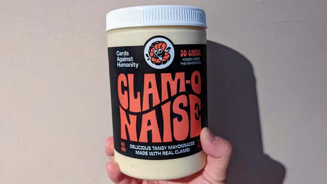 hand holding jar of clam-o-naise