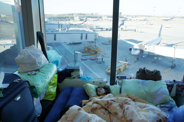 Image for article titled Photos: A family of Kurdish refugees is living in a Moscow airport lounge
