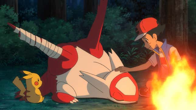 Ash and Pikachu are shown nursing Latias back to health next to a campfire.