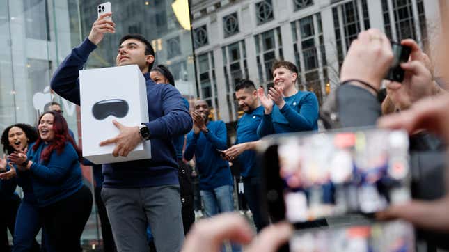 arish Syed holds up the first purchase of the Apple Vision Pro headset at the Fifth Avenue Apple store on February 02, 2024 in New York City. 
