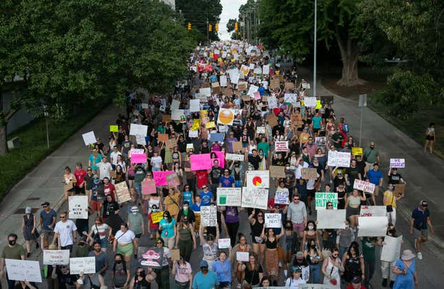 People gather to protest against the the Supreme Court’s decision in the  Dobbs v Jackson Women’s Health case on June 24, 2022 in Raleigh, North  Carolina