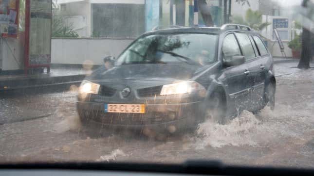 A Renault Megane Wagon driving through the rain