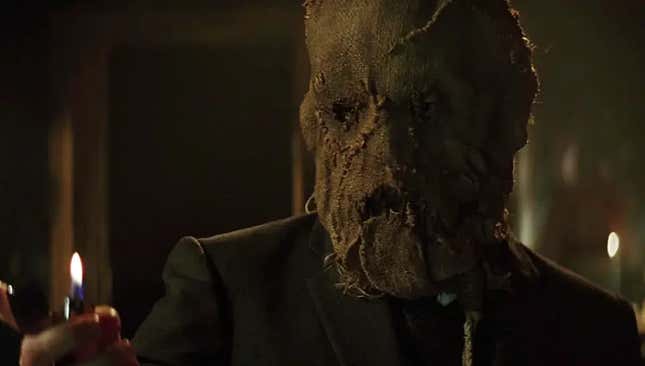 Scarecrow flicking a lighter