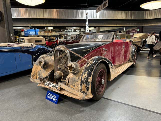 Front 3/4 view of a dirty red-and-black 1928 Avions Voisin Type C28 Recreation