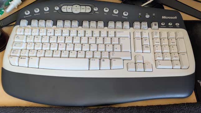 The new keyboard in all its glory, complete with Blu-Tac over the light.