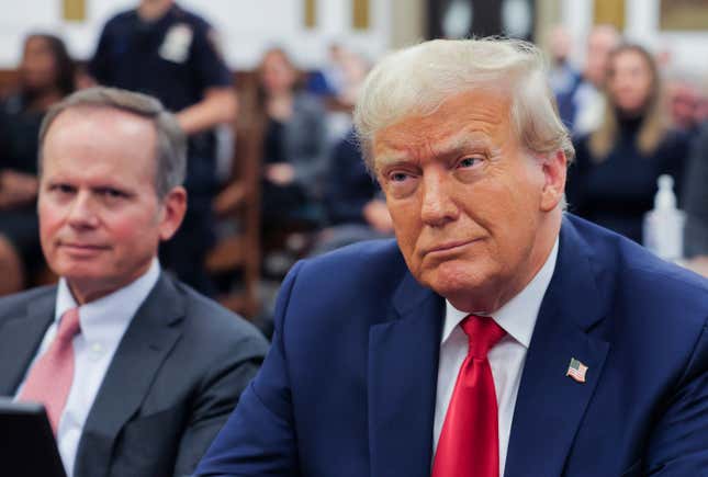 Former President Donald Trump sits in the courtroom with his legal team before the continuation of his civil business fraud trial at New York Supreme Court, Tuesday, Oct. 17, 2023, in New York. (Andrew Kelly/Pool Photo via AP)