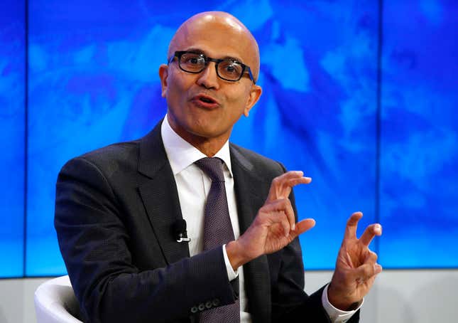 Image for article titled Photos: What everyone’s really saying at Davos, in body language