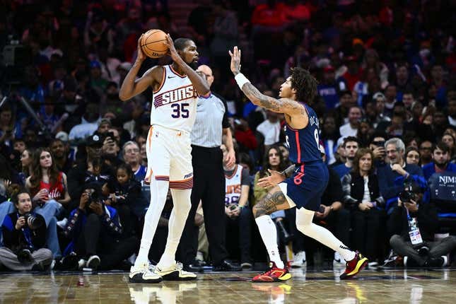 Nov 4, 2023; Philadelphia, Pennsylvania, USA; Phoenix Suns forward Kevin Durant (35) controls the ball against Philadelphia 76ers guard Kelly Oubre Jr (9) in the third quarter at Wells Fargo Center.