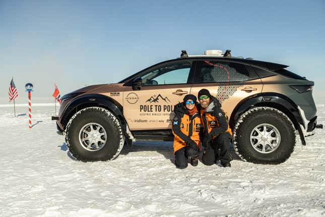 The Ramseys kneeling beside their Nissan Ariya that just took them from the North Pole to the South Pole.