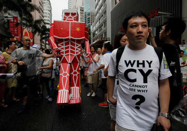 A Hong Kong protester marches in 2013.