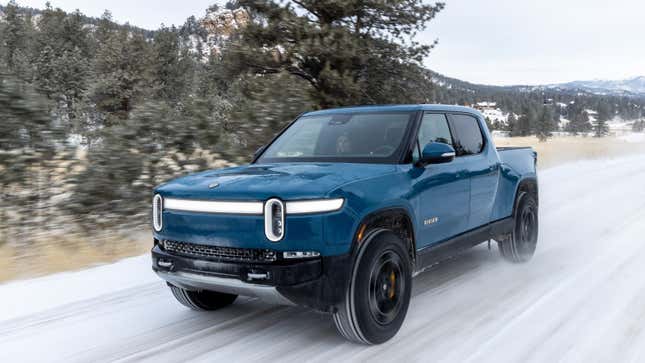 A photo of a blue Rivian R1T electric pickup truck. 
