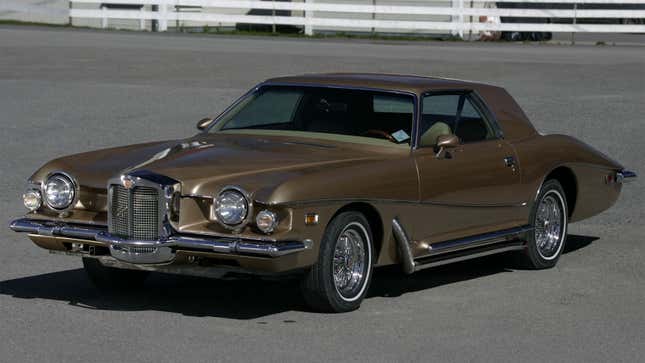 A photo of a gold Stutz Blackhawk car. 