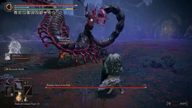 The player character in Elden Ring fights a massive scorpion boss.