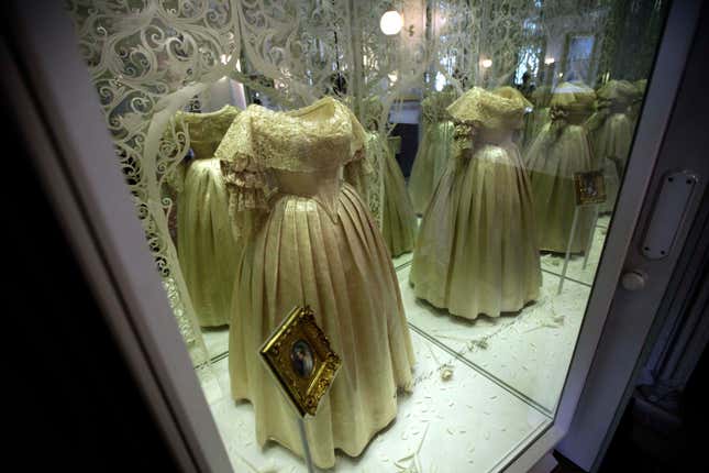 The ivory silk wedding dress worn by Queen Victoria in her marriage to Prince Albert in 1840 is displayed and then reflected in mirrors as part of the exhibition "Victoria Revealed" in the building where she was born, Kensington Palace in London, Tuesday, March 20, 2012. Kensington Palace has been transformed following a 12 million pounds ($19 million, 14.4 million euro) restoration project timed to be completed for this summer's Queen Elizabeth II's Diamond Jubilee and the London 2012 Olympics. (AP Photo/Matt Dunham)