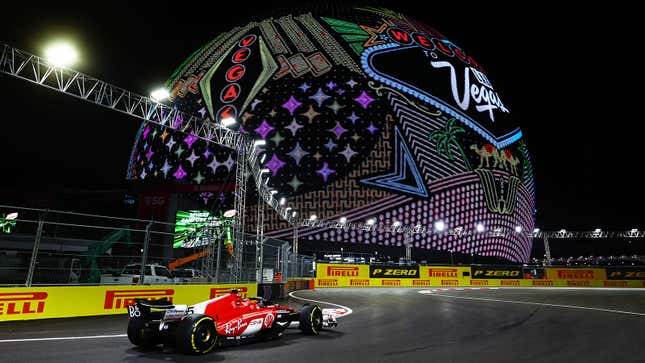 A phoot of Carlos Sainz driving past the Las Vegas Sphere. 