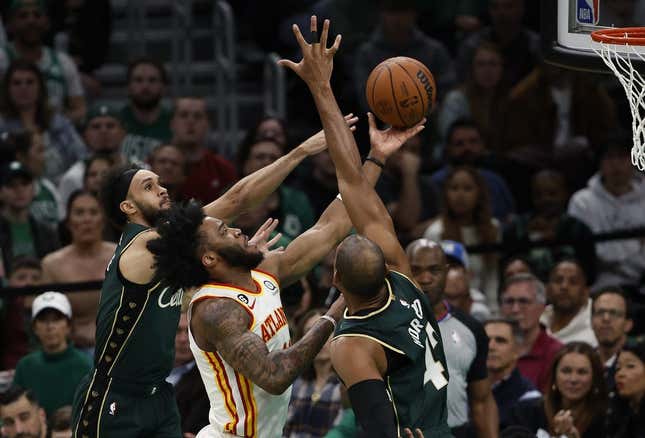 Apr 25, 2023; Boston, Massachusetts, USA; Atlanta Hawks forward Saddiq Bey (41) goes between Boston Celtics center Al Horford (42) and guard Derrick White (9) during the second quarter of game five of the 2023 NBA playoffs at TD Garden.