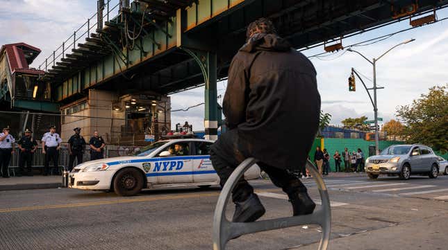 Police and protesters gather outside of a Brownsville Brooklyn subway station following a shooting on Sunday of a subway fare evader on September 17, 2024 in New York City.