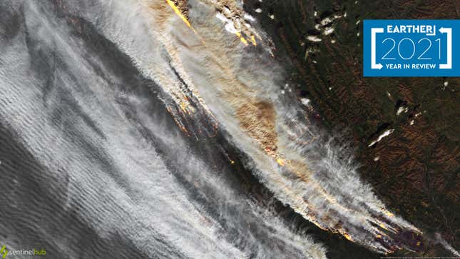 A satellite view shows thick smoke spreading over the landscape. Hot spots are visible below.