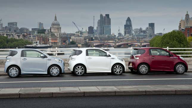 Three Aston Martin Cygnets in blue, white and red.