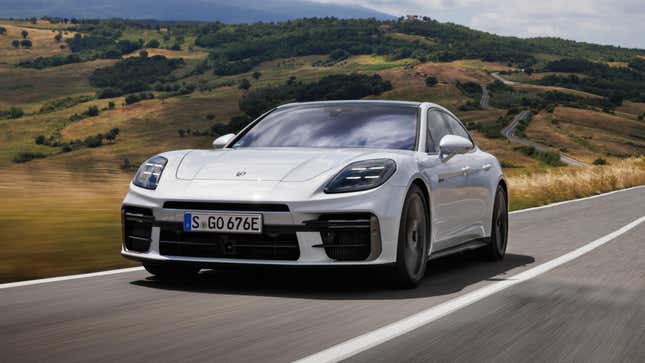 Front 3/4 view of a white Porsche Panamera Turbo S E-Hybrid