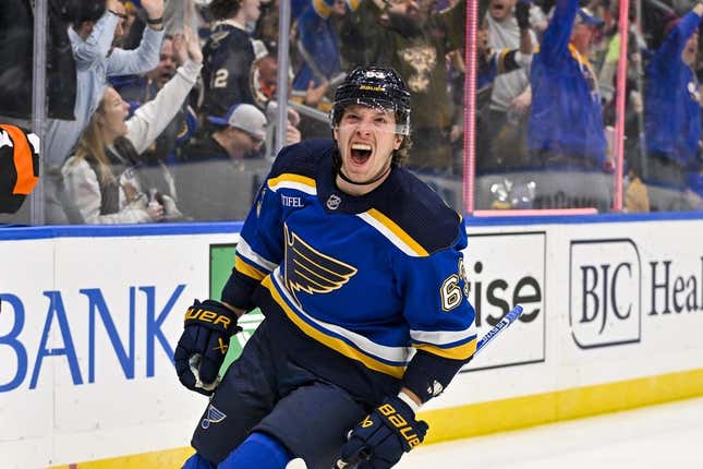 Nov 3, 2023; St. Louis, Missouri, USA;  St. Louis Blues left wing Jake Neighbours (63) reacts after scoring against the New Jersey Devils during the second period at Enterprise Center.