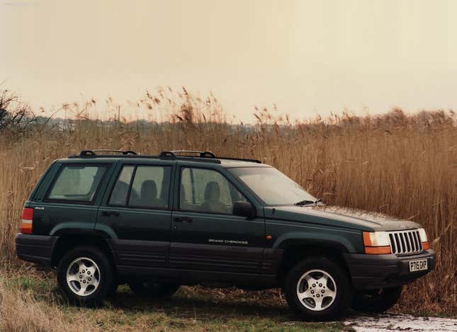 A UK-Spec 1996 Jeep Grand Cherokee parked in a field of wheat.