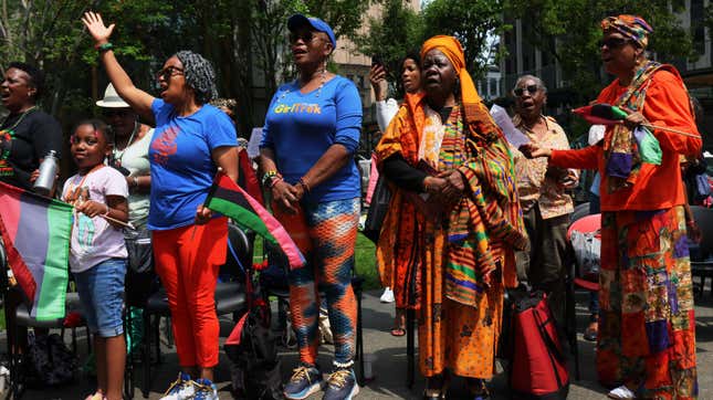 NEW YORK, NEW YORK - JUNE 19: People sing “Lift Every Voice and Sing” during a Juneteenth celebration at the African Burial Ground National Monument on June 19, 2023 in New York City. 