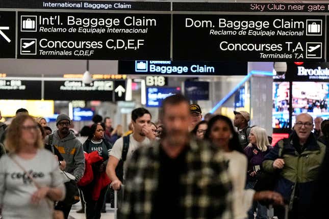 Travelers move through the B terminal at Hartsfield-Jackson Atlanta International Airport, Saturday, Jan. 27, 2024, in Atlanta. On Tuesday, Feb. 27, 2024, the Conference Board reports on U.S. consumer confidence for February. (AP Photo/Mike Stewart)