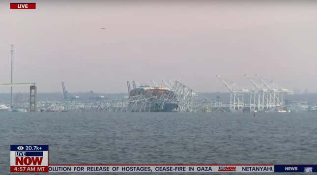 A screenshot of a news report showing a cargo ship crashed into a bridge. 