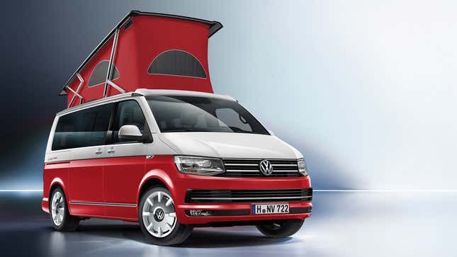 Front-quarter view of a two-tone Volkswagen California camper van in white and red, with the roof tent extended