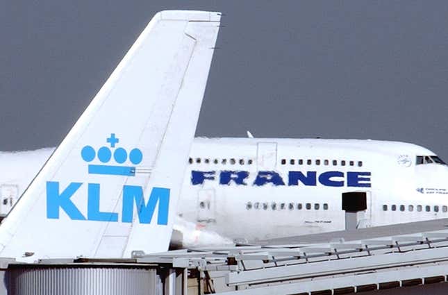 FILE - An Air France jumbo jet rolls behind the tail of a KLM Royal Dutch airliner at Charles de Gaulle airport in Roissy, north of Paris. On Sept. 30, 2003. Low-cost carriers Ryanair and Malta Air won a European court case Wednesday Dec.20 2023 against the EU&#39;s decision to approve billions of euros of state aid by the French government to holding company Air France-KLM during the COVID-19 pandemic. (AP Photo/Remy de la Mauviniere, File)