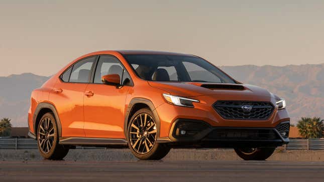 A photo of an orange Subaru WRX. 