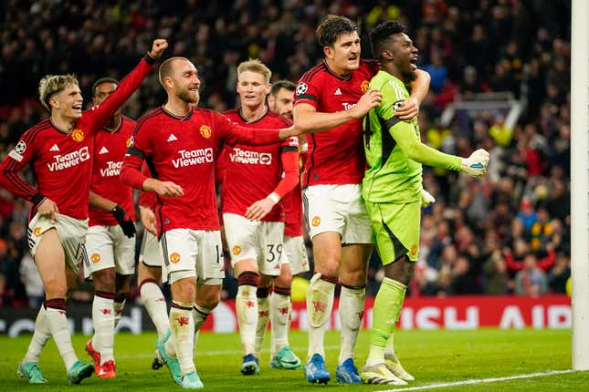 Manchester United&#39;s goalkeeper Andre Onana, right, celebrates with teammates after makes a save penalty shoot during the Champions League group A soccer match between Manchester United and Copenhagen at the Old Trafford stadium in Manchester, England, Tuesday, Oct. 24, 2023. (AP Photo/Dave Thompson)