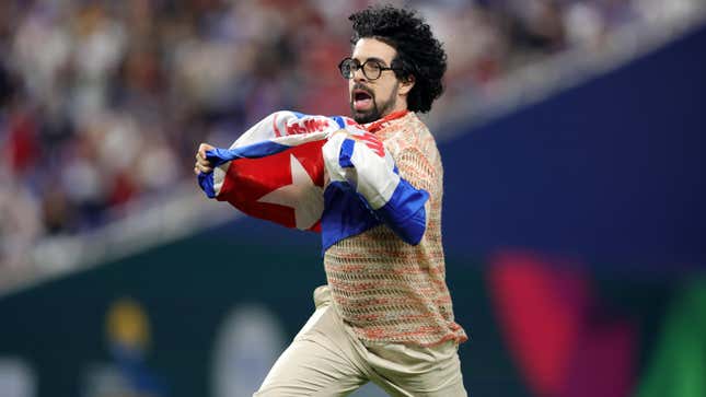 A fan runs on the field during the World Baseball Classic Semifinals between Team Cuba and Team USA at loanDepot park on March 19, 2023 in Miami, Florida. 