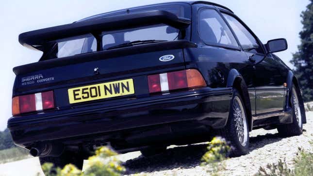 A photo of the rear end on a black Ford Sierra Cosworth car. 