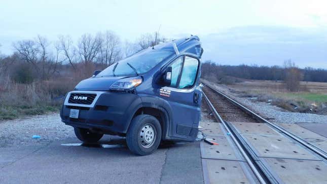 Image for article titled Amazon Delivery Van Cut In Half By Amtrak Train