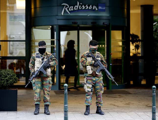 Belgian soldiers stand guard outside the Radisson Blu hotel in central Brussels, November 21, 2015, after security was tightened in Belgium following the fatal attacks in Paris. Belgium raised the alert status for its capital Brussels to the highest level on Saturday, shutting the metro and warning the public to avoid crowds because of a "serious and imminent" threat of an attack.