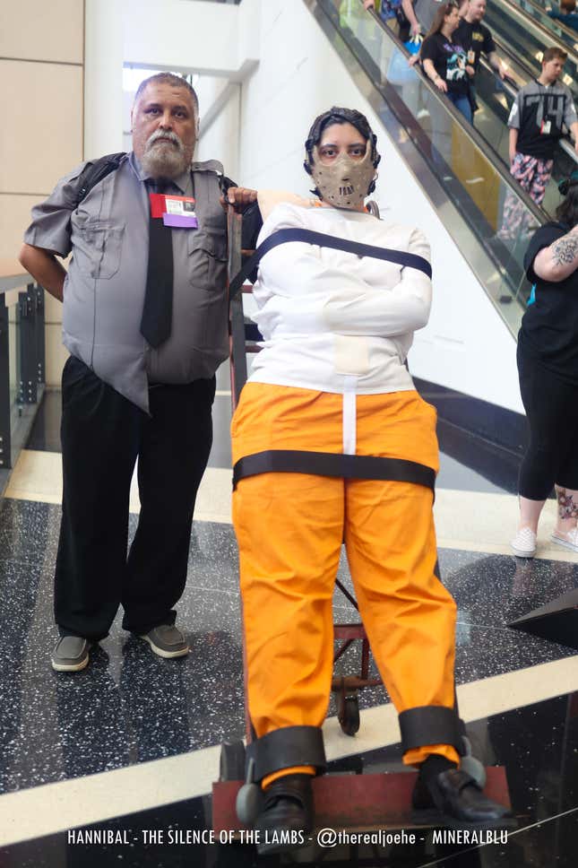 A cosplayer dressed as Hannibal is strapped to stretcher.