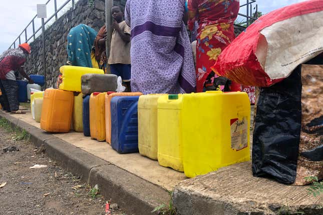 FILE - People queue to fill up containers with water in Tsoundzou, Mayotte island, Saturday Feb.6, 2021 during the Covid pandemic. France is sending military forces to distribute water on the French Indian Ocean territory of Mayotte, which is facing an unprecedented water crisis prompted by the island&#39;s most severe drought in decades. Troops with the French Foreign Legion and French navy based in the region will work with local authorities to ensure water supplies to local populations, the Defense Ministry said in a statement Thursday Sept. 14, 2023. (AP Photo/ Sony Ibrahim Chamsidine, File)