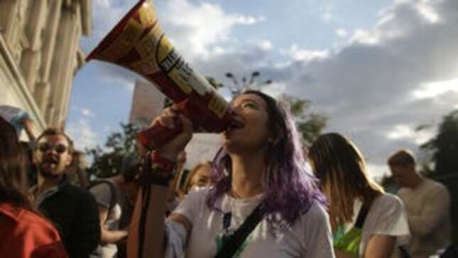 Activists participate in a rally demanding action on climate change in Bucharest, Romania on Sept. 20.